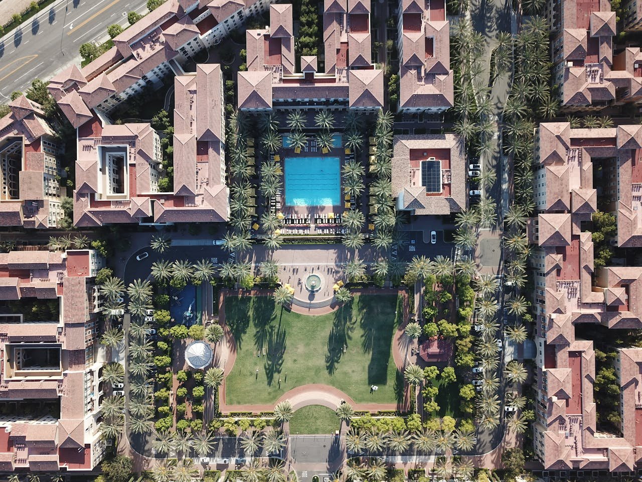 Modern apartment complex with amenities and landscaped spaces - 1